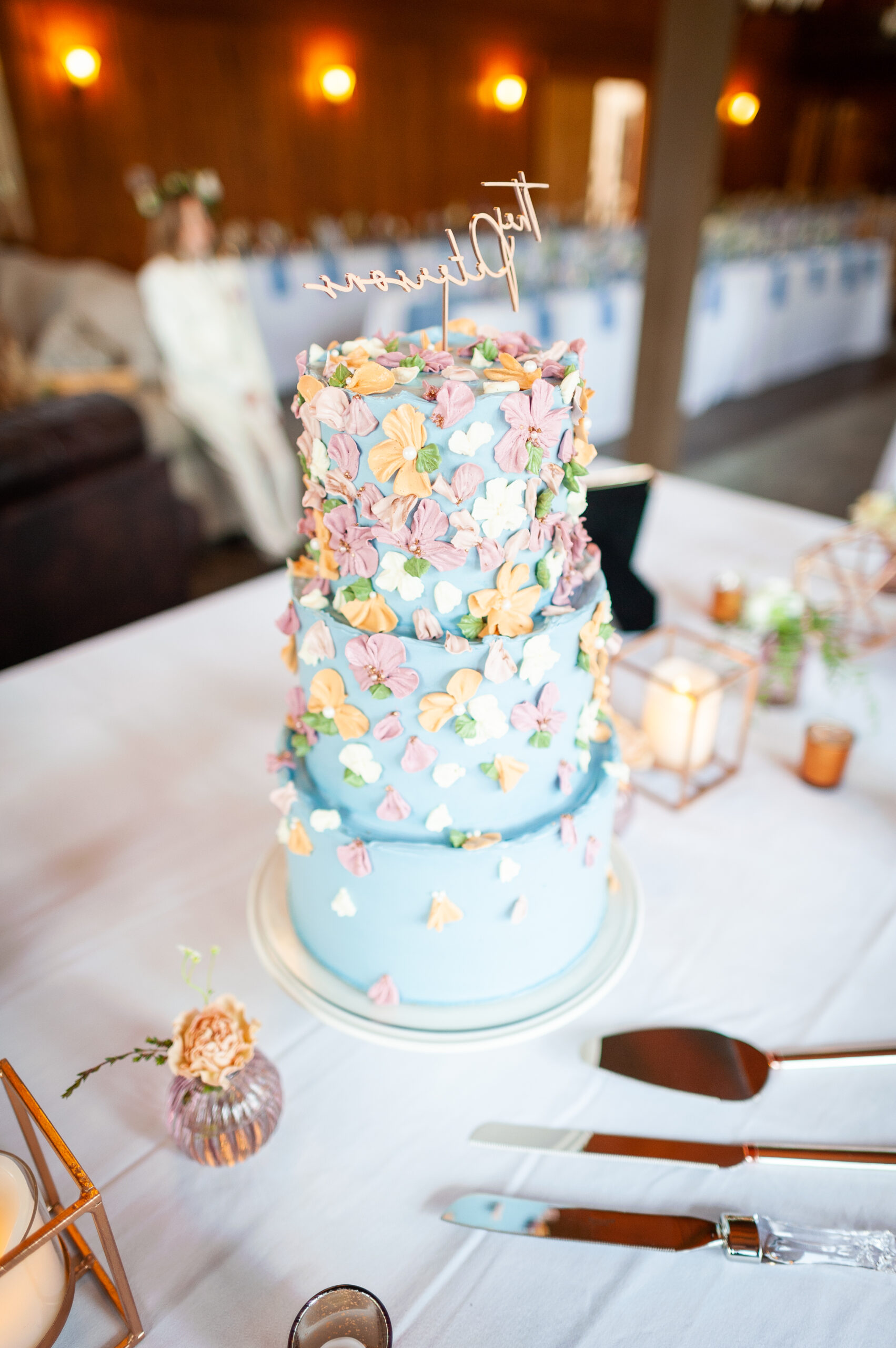 Blue, Orange, and Pink Tiered Buttercream Flower Wedding Cake