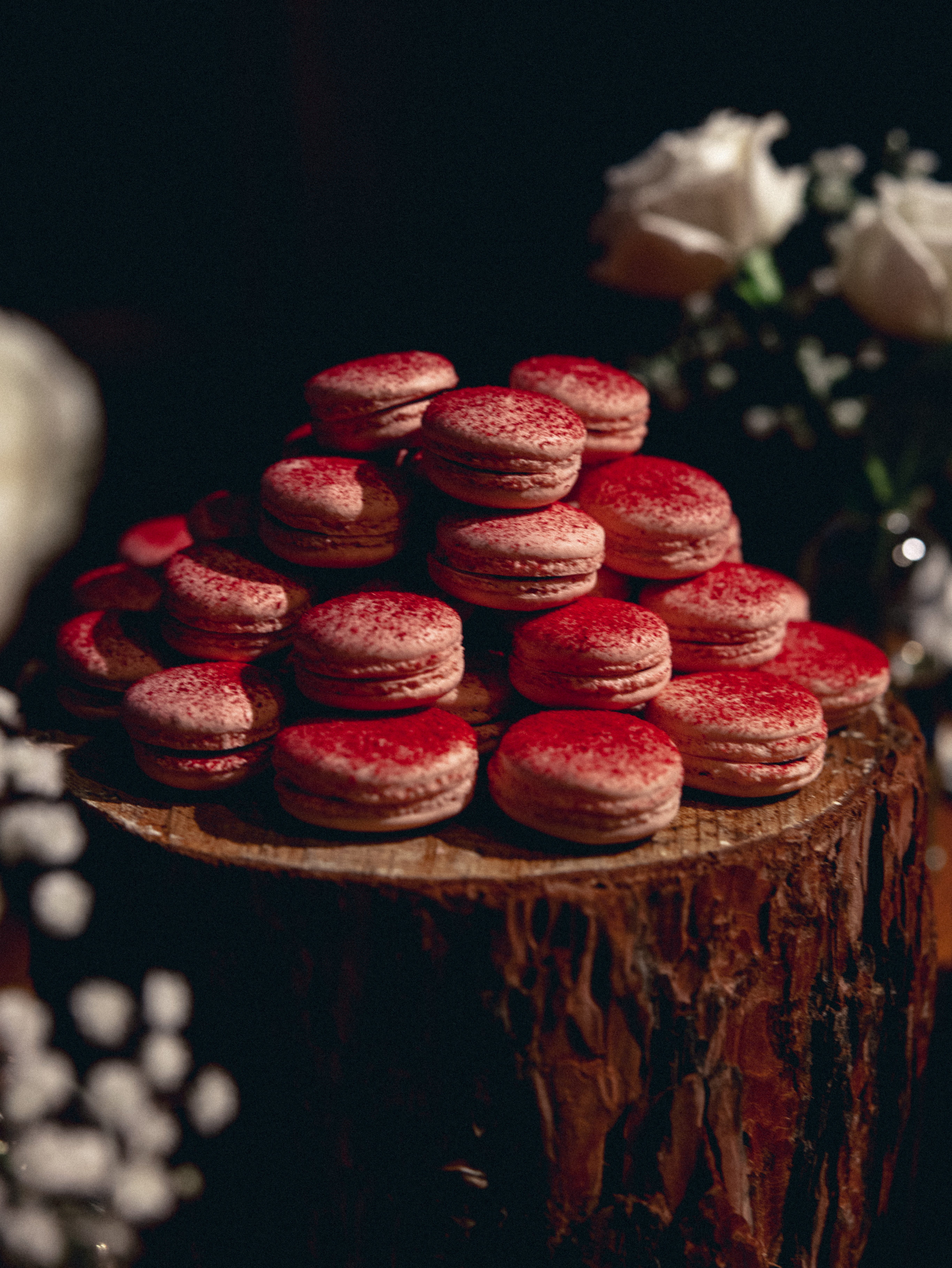 Pink raspberry macarons stacked on platter - Britt Rene Photo